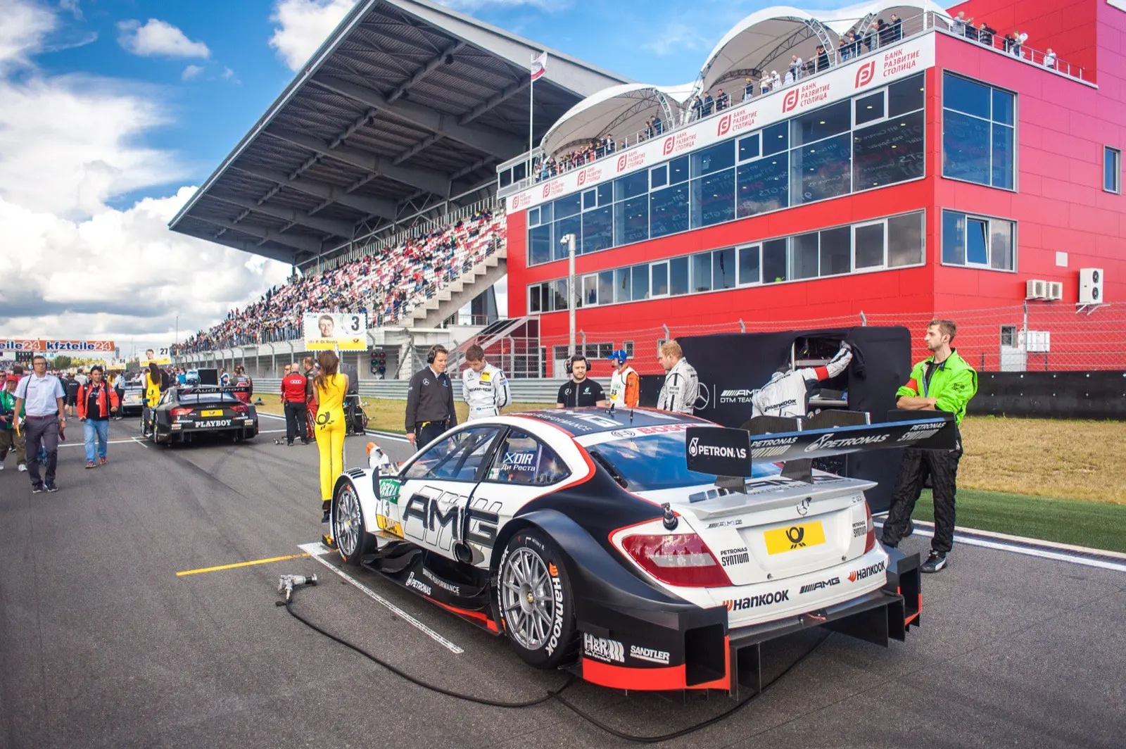Race cars lined up on the grid before a DTM race