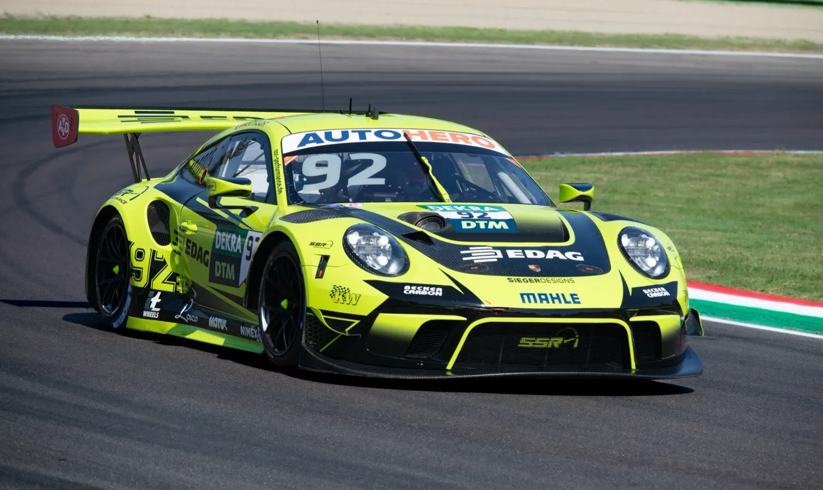 Porsche race car mid-corner showing multiple simultaneous inputs that overwhelm conscious processing requiring flow state